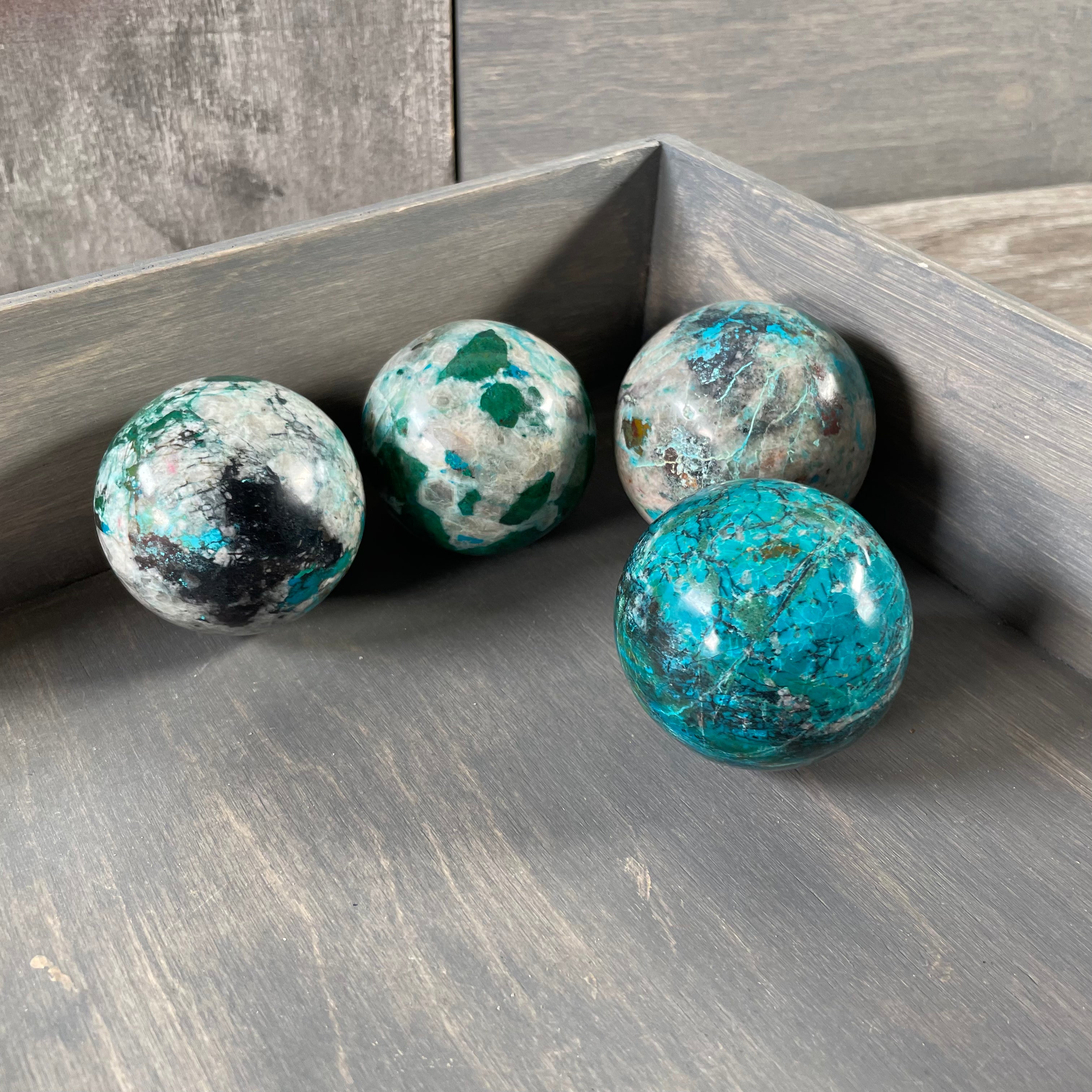 Hand-polished Chrysocolla spheres in bulk