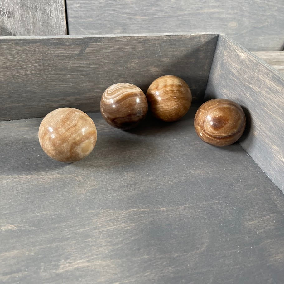 Aragonite gemstone sphere for metaphysical use