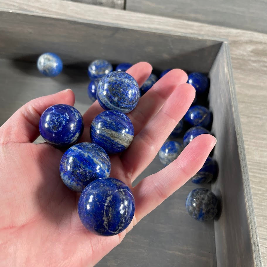 Wholesale polished Lapis Lazuli spheres for resale.