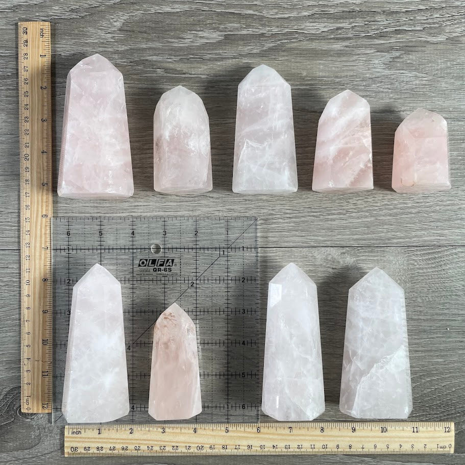 Bulk rose quartz obelisks from Madagascar in natural pink tones