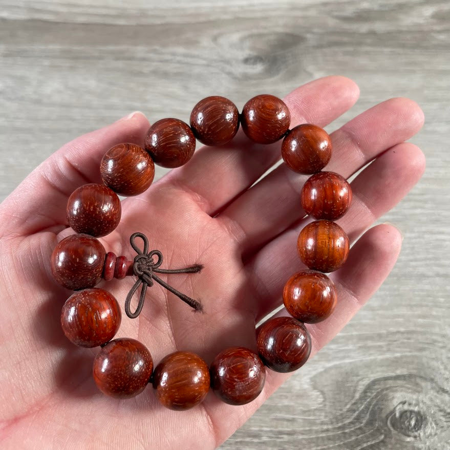 wooden beaded yoga bracelet on display