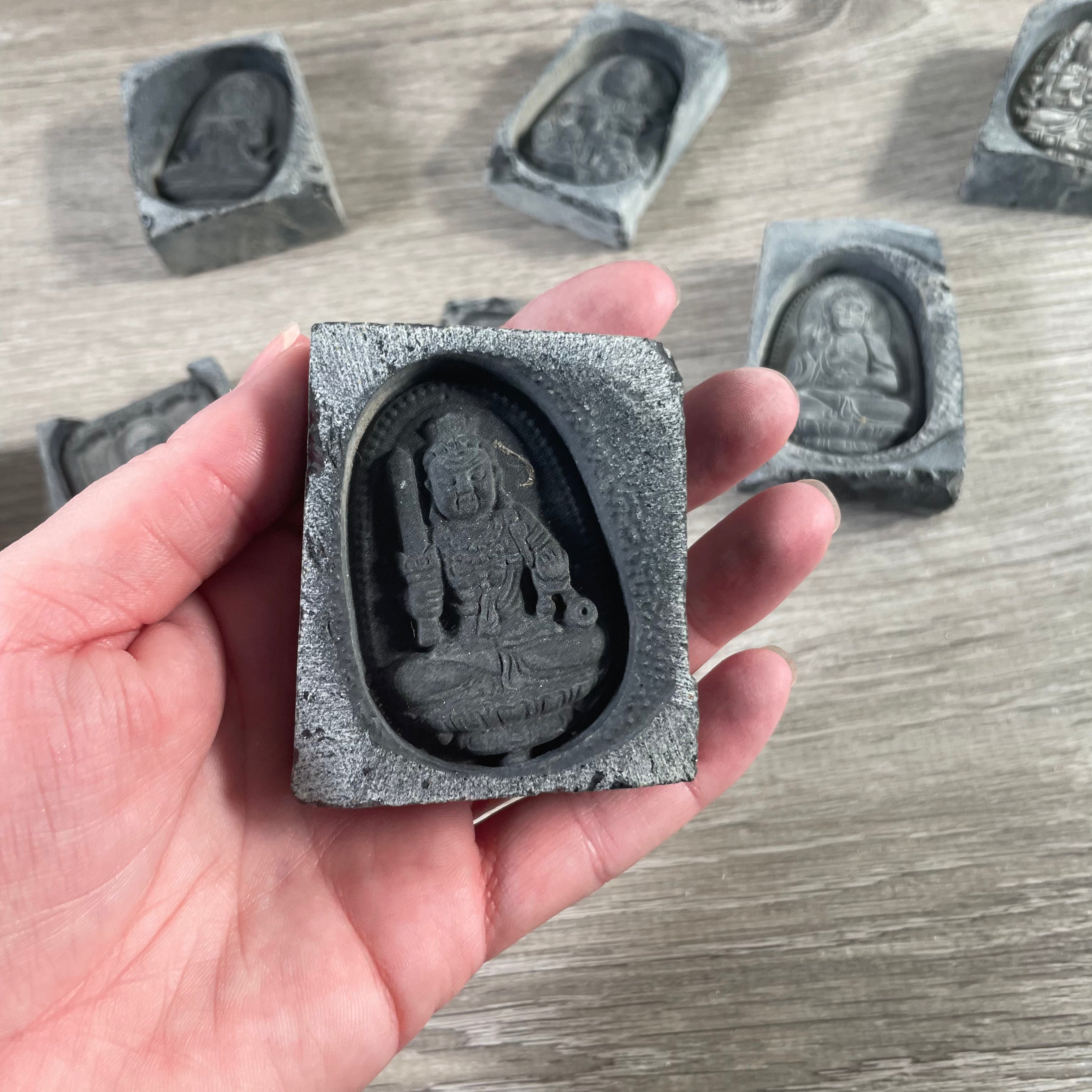 Wholesale obsidian tiles with intricate deity carvings