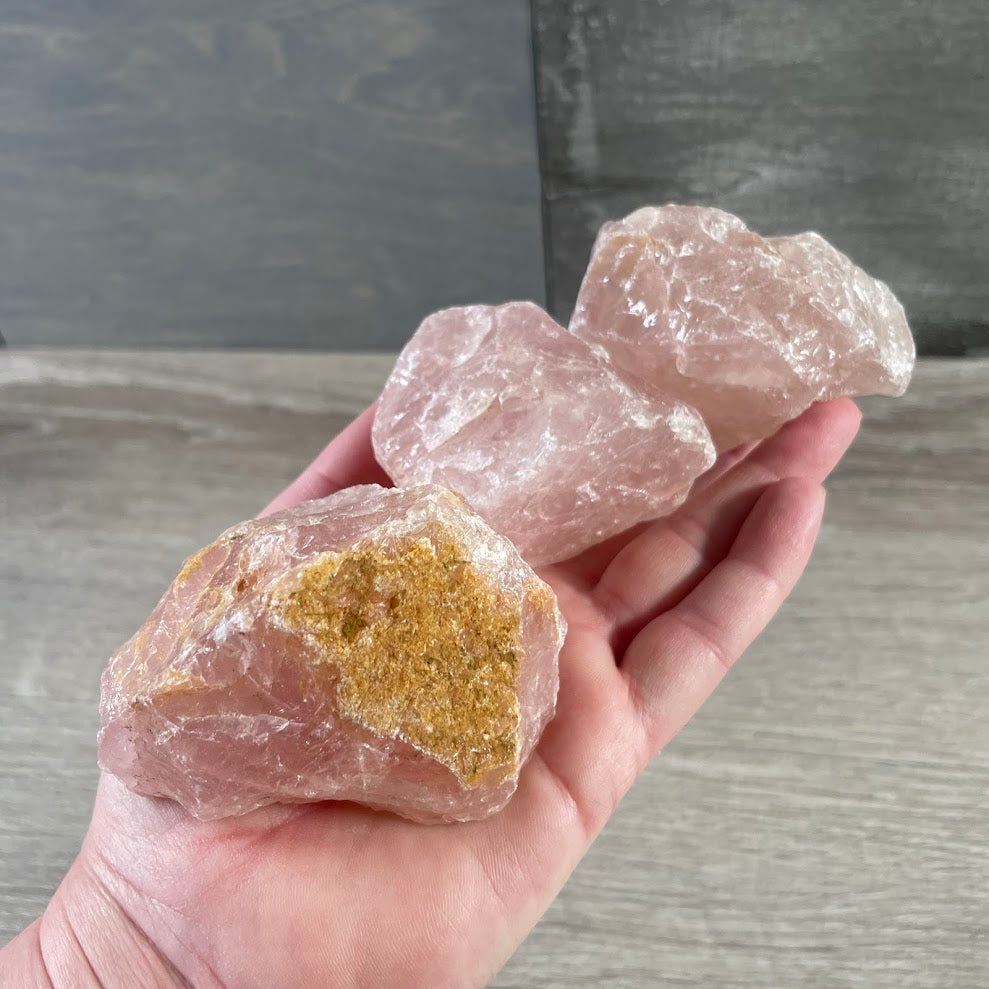 Wholesale rose quartz chunks with natural texture and unique shapes