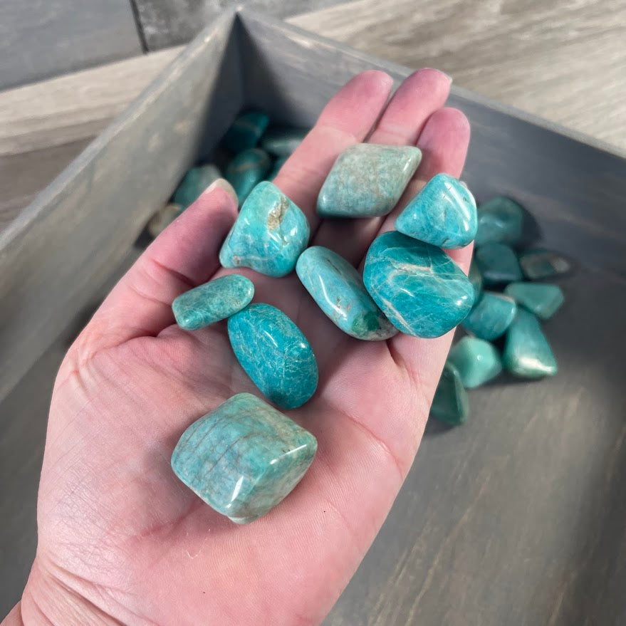 Blue-green Amazonite polished crystal stones in bulk