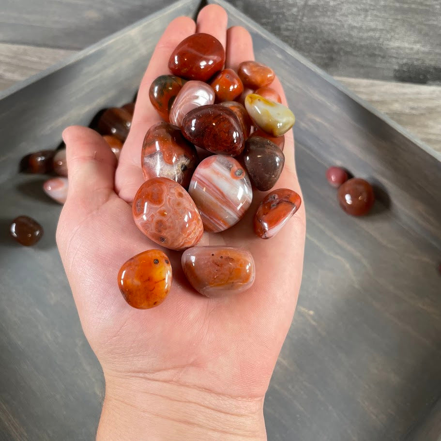 Bulk carnelian tumbled stones polished for resale and crystal shops
