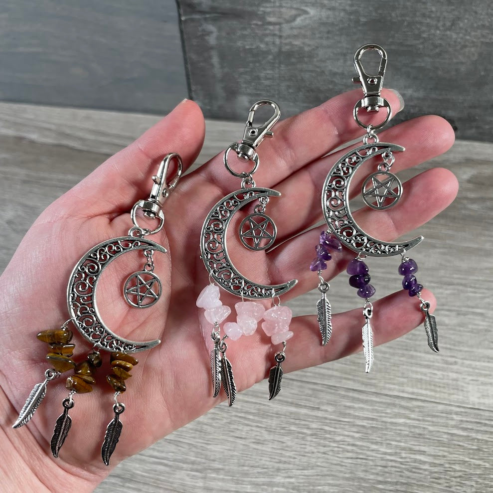 Assorted crescent moon dream catcher keychains with boho celestial designs