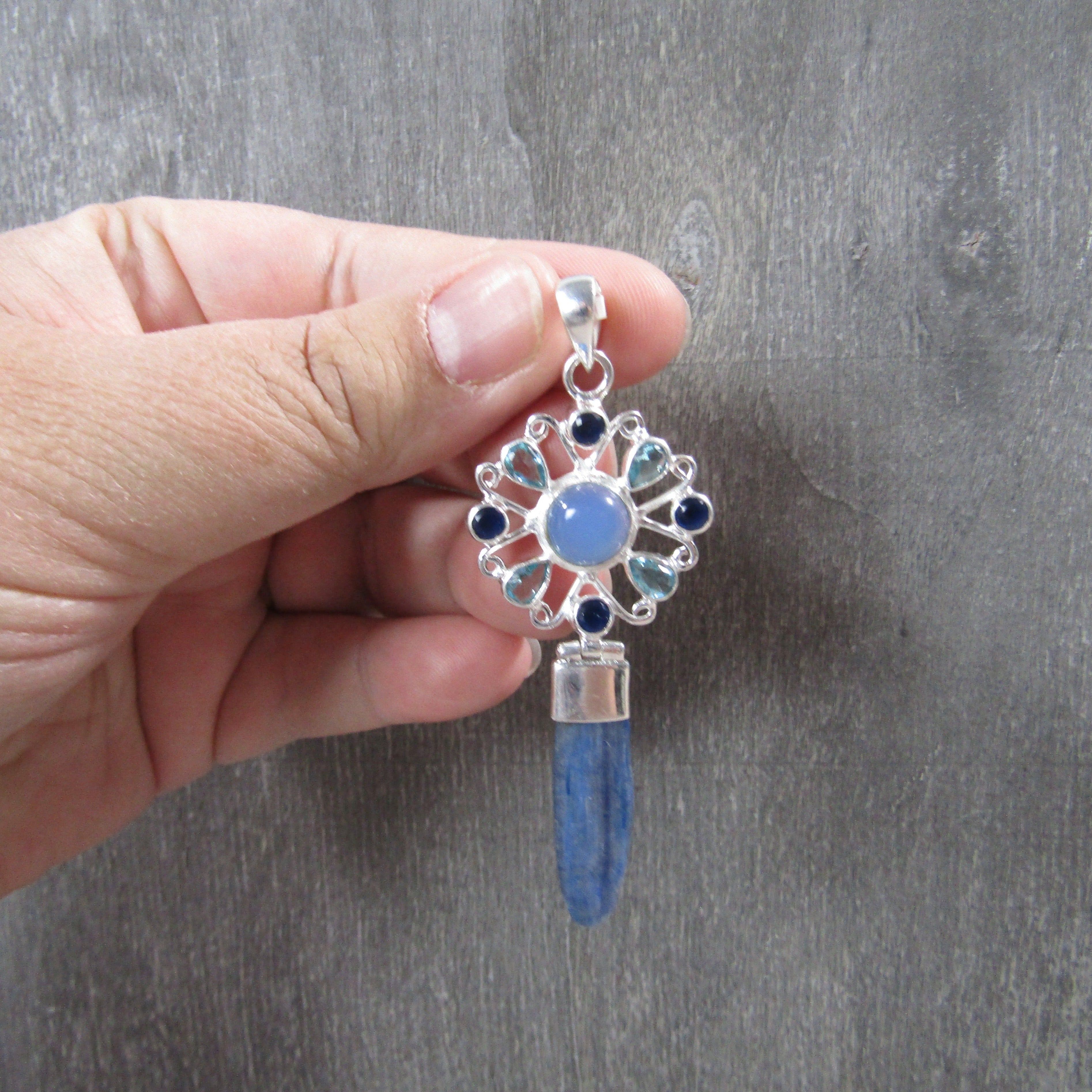 blue kyanite gemstone pendant in silver setting