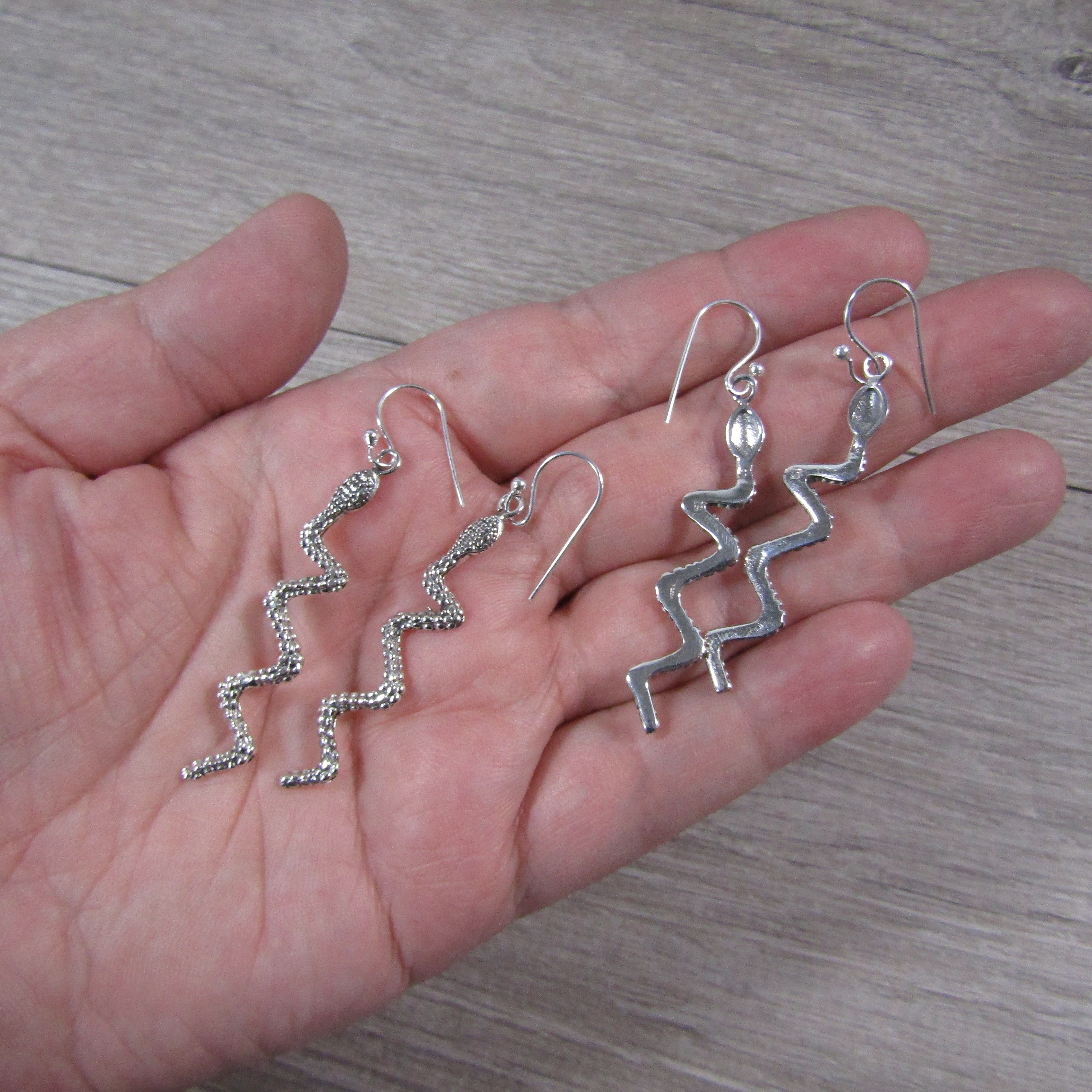 Silver snake earrings for resale.