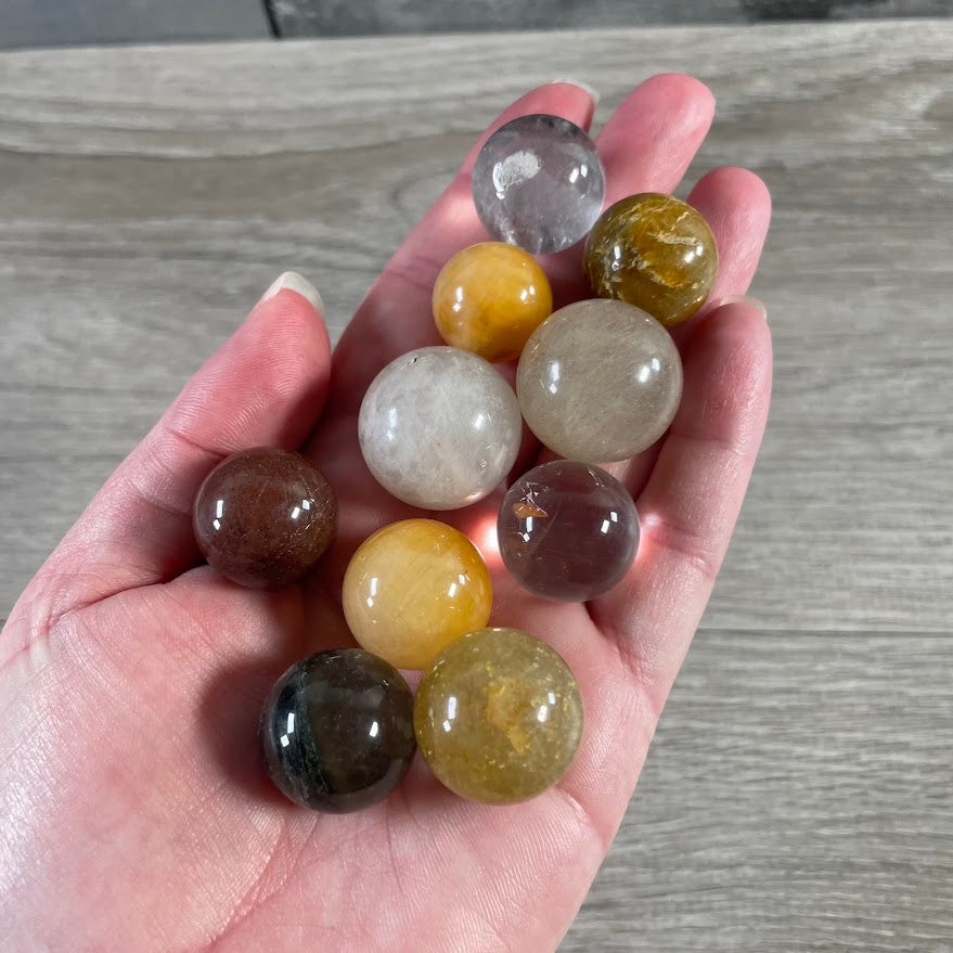 Natural lodalite quartz sphere with mineral inclusions small polished gemstone sphere
