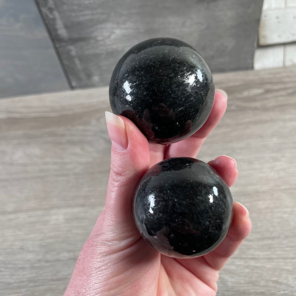 Nuummite sphere with dark natural shimmer for crystal shops