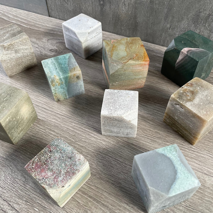 Polished Ocean Jasper cube with natural green and cream patterns