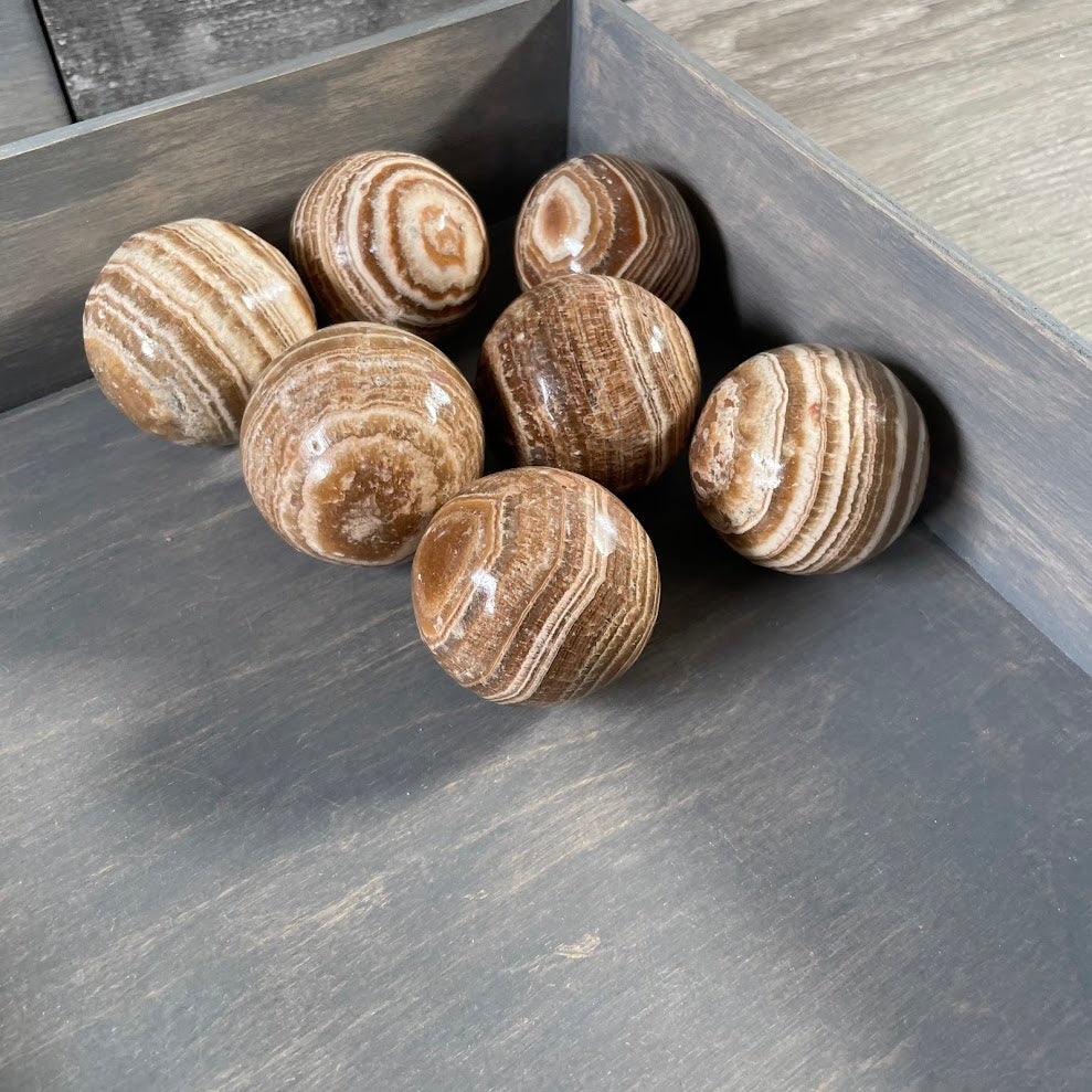 Wholesale Aragonite banded crystal sphere for gift shops and home decor