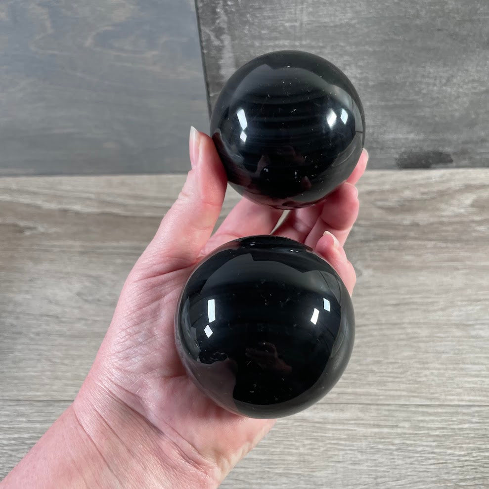 Polished obsidian sphere for crystal collections, spiritual shops, and home décor
