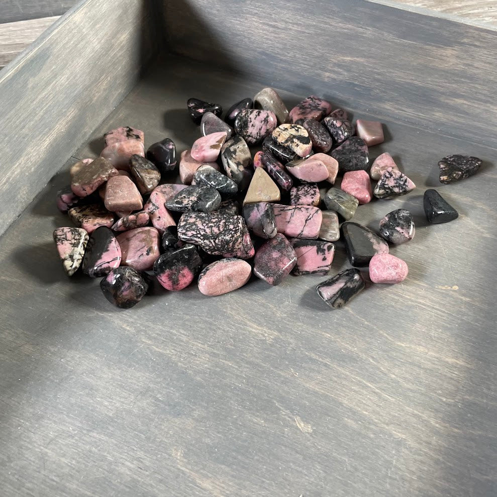 Natural rhodonite crystal lot with assorted polished tumbled stones
