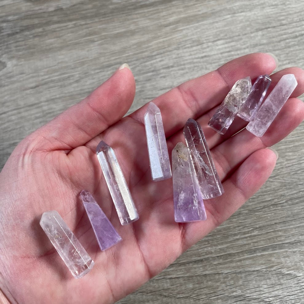 Natural amethyst gemstone tower handmade in Brazil with polished obelisk design.