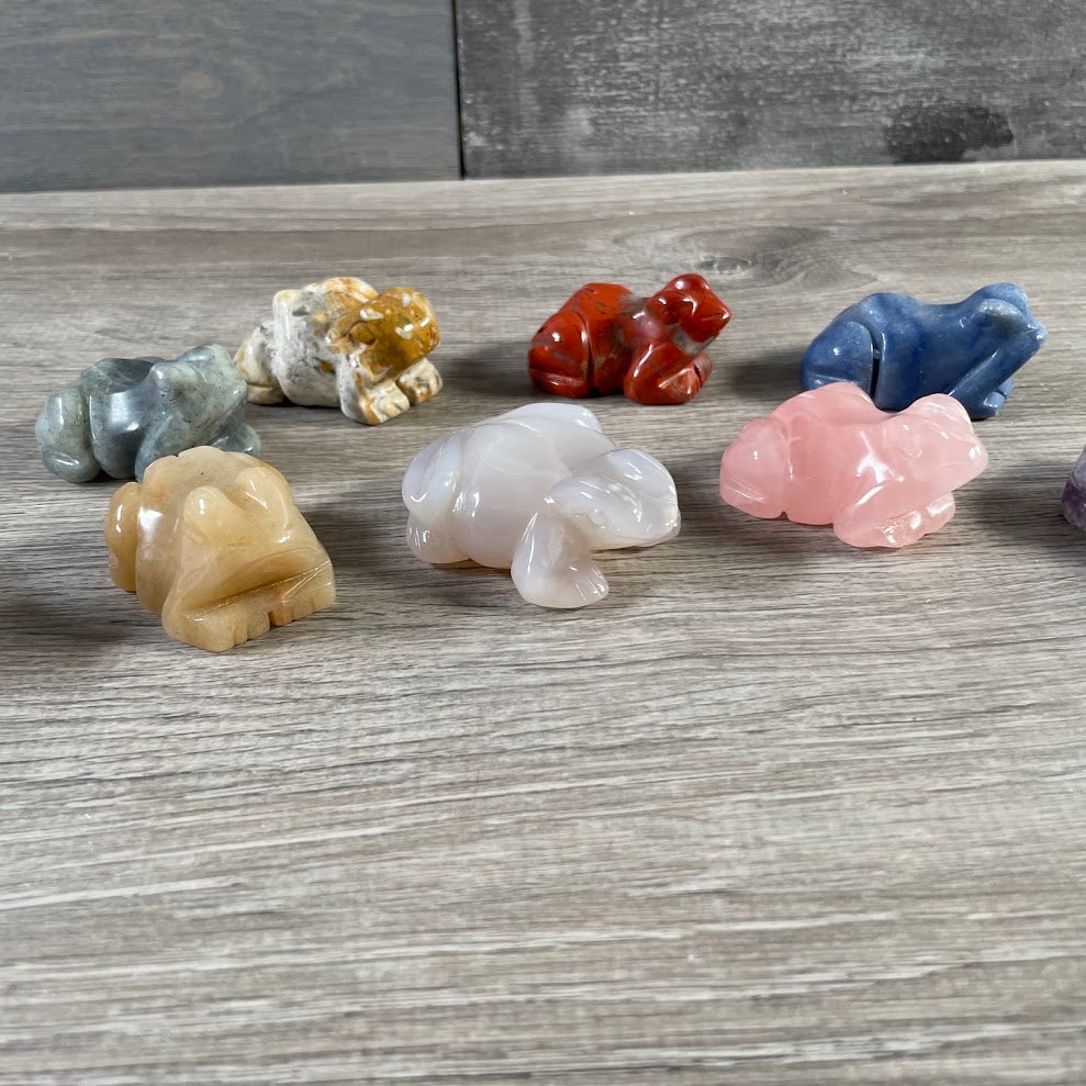 Crystal frog figurines in assorted stones for wholesale inventory