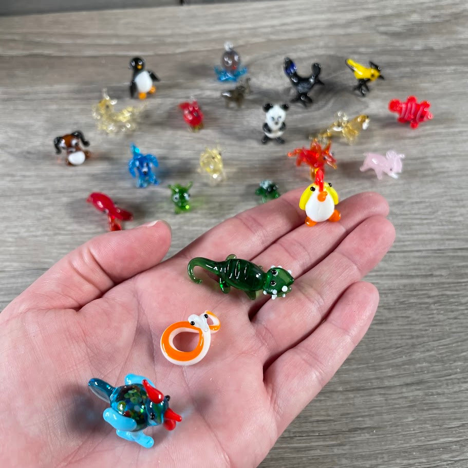 assorted small glass animal figurines in assorted miniature animal designs, ideal for gift shops