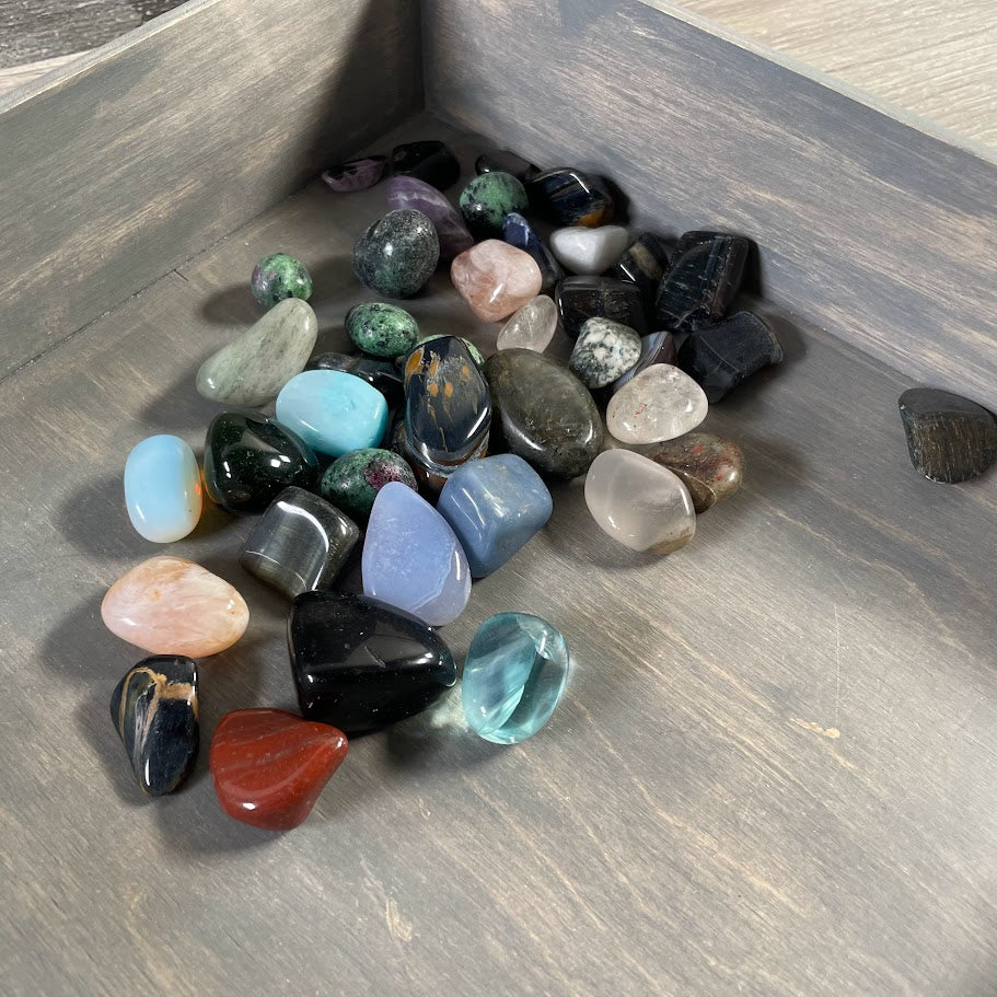 Assorted polished tumbled gemstones in a 1 pound mixed crystal lot for wholesale resale