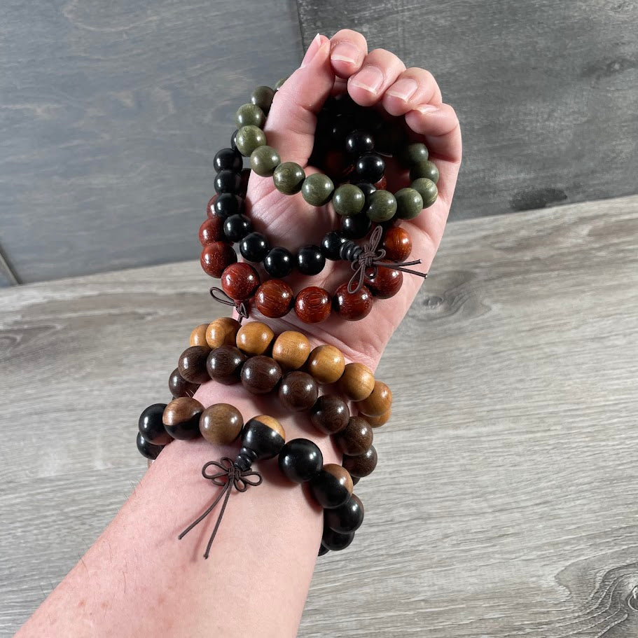 Wholesale wood mala power bead bracelet featuring smooth natural wooden beads for meditation jewelry retailers