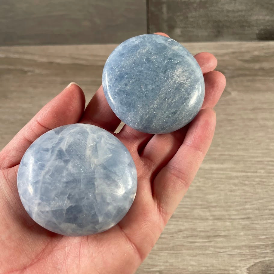 Bulk wholesale palm stones featuring blue calcite natural gemstones for crystal resale