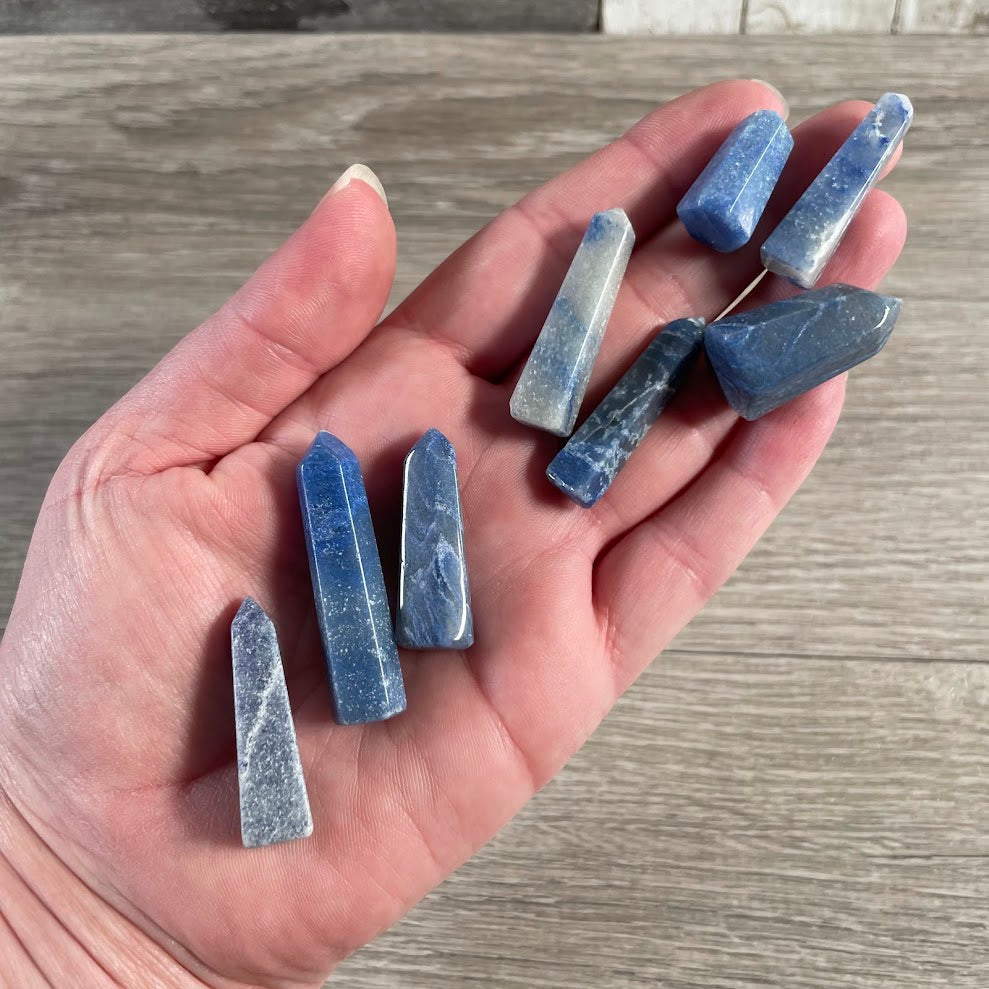Handmade blue quartz natural stone obelisk from Brazil with pointed crystal tower shape.