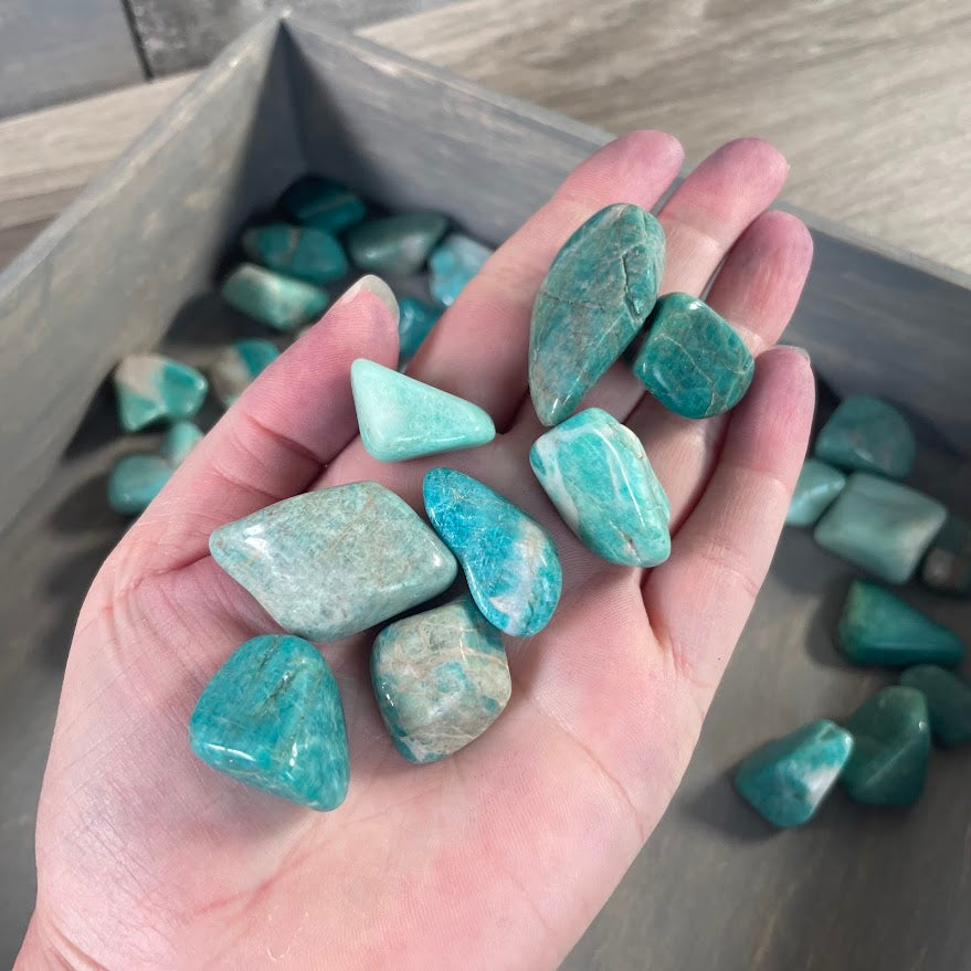 Assorted Amazonite tumbled stones in a 1 pound wholesale lot featuring aqua blue and green gemstone variations