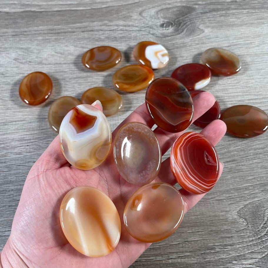 carnelian bulk gemstone pocket stones in smooth polished oval shapes