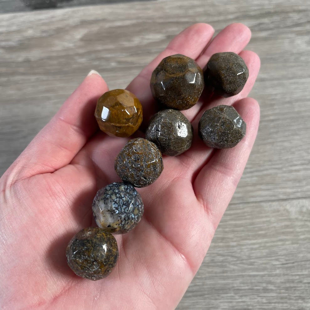 cosmic jasper faceted crystal sphere featuring natural gemstone color, pattern, and inclusions