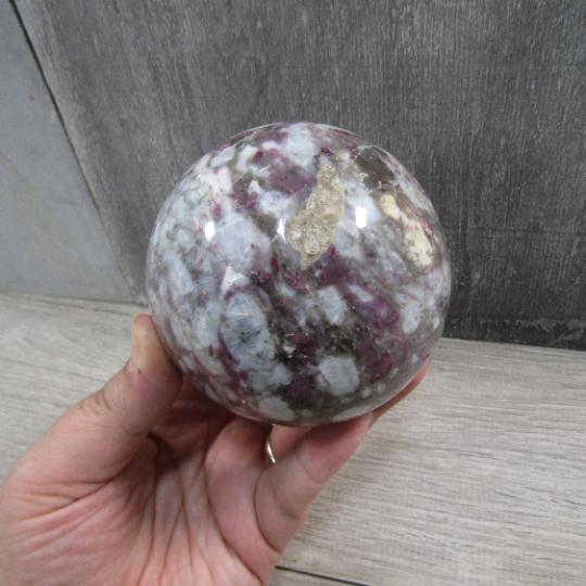 Retail-ready pink tourmaline sphere for crystal shops