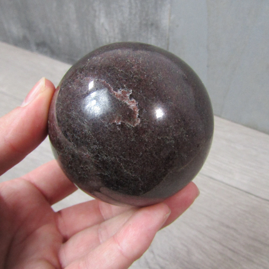 Hand-Polished Garnet Sphere with Rich Red Hues
