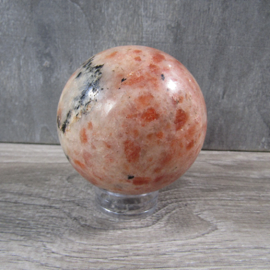 Polished peach sunstone sphere for metaphysical shops