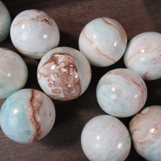 Calcite natural crystal spheres sold by size for metaphysical stores