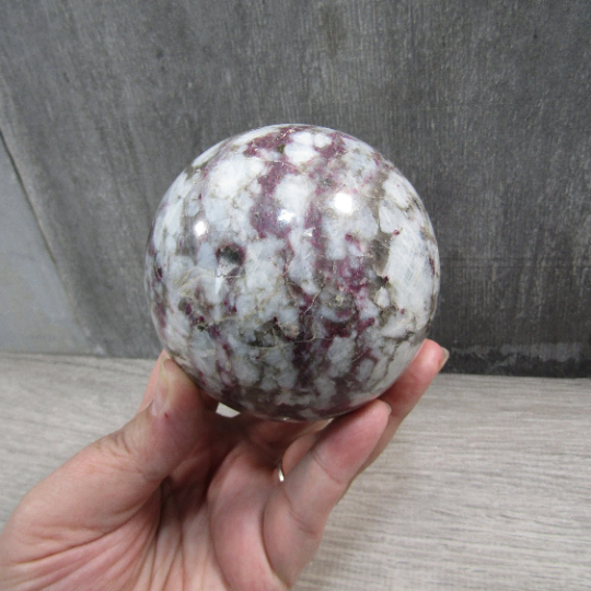 Display-size pink tourmaline quartz sphere for metaphysical stores