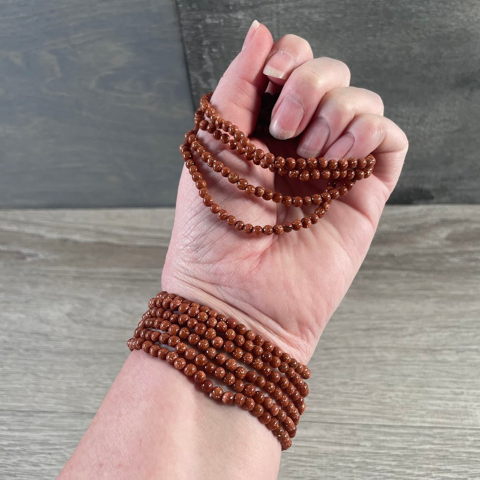 goldstone gemstone stacking bracelet with polished 4mm crystal beads