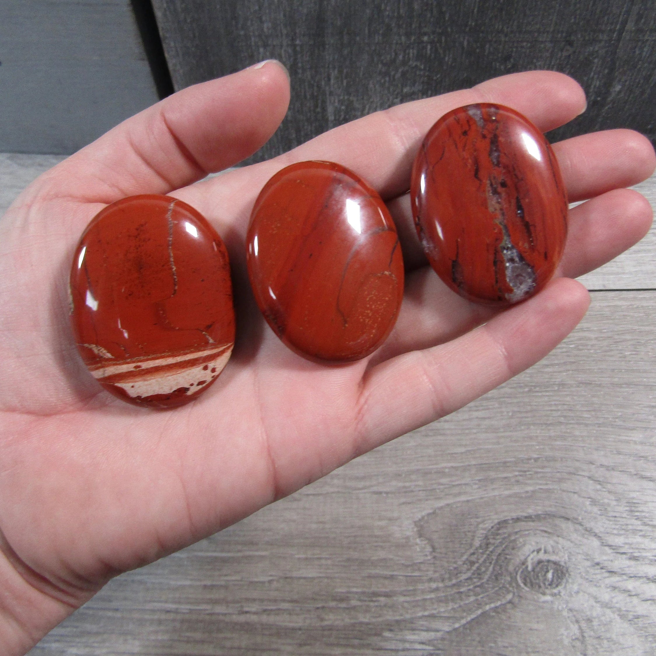 red jasper polished oval palm stones for resale