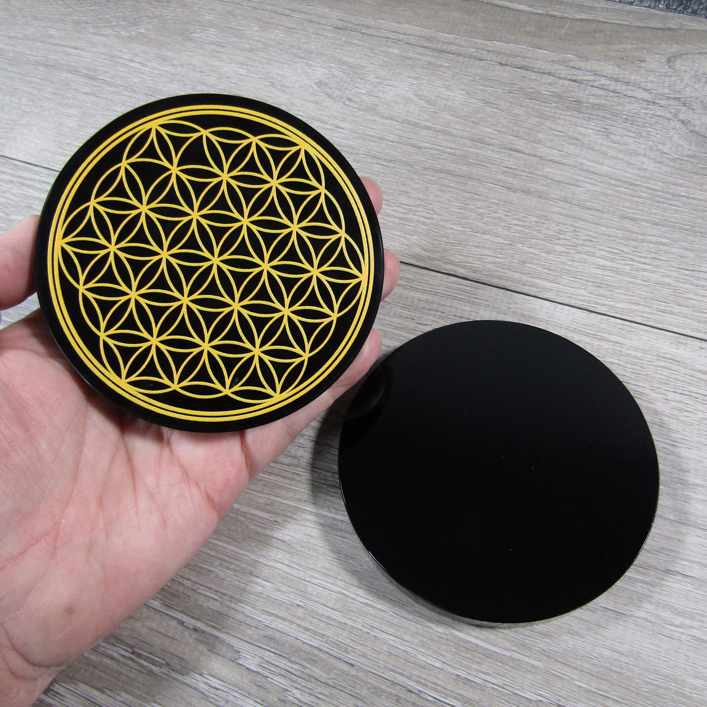 Etched obsidian disk used as a gridding tool for spiritual energy work and manifestation