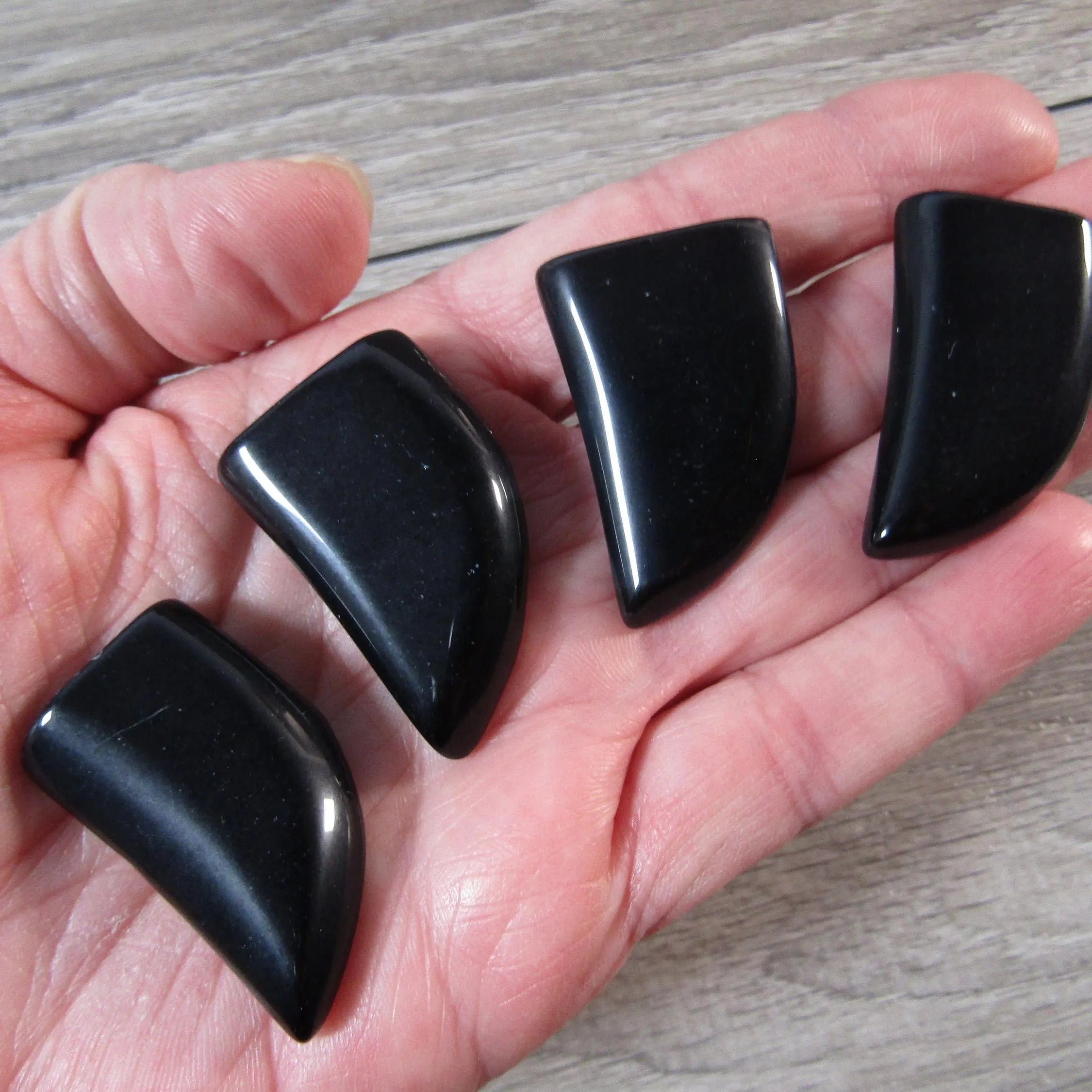 Natural black obsidian male-inspired shape with smooth finish