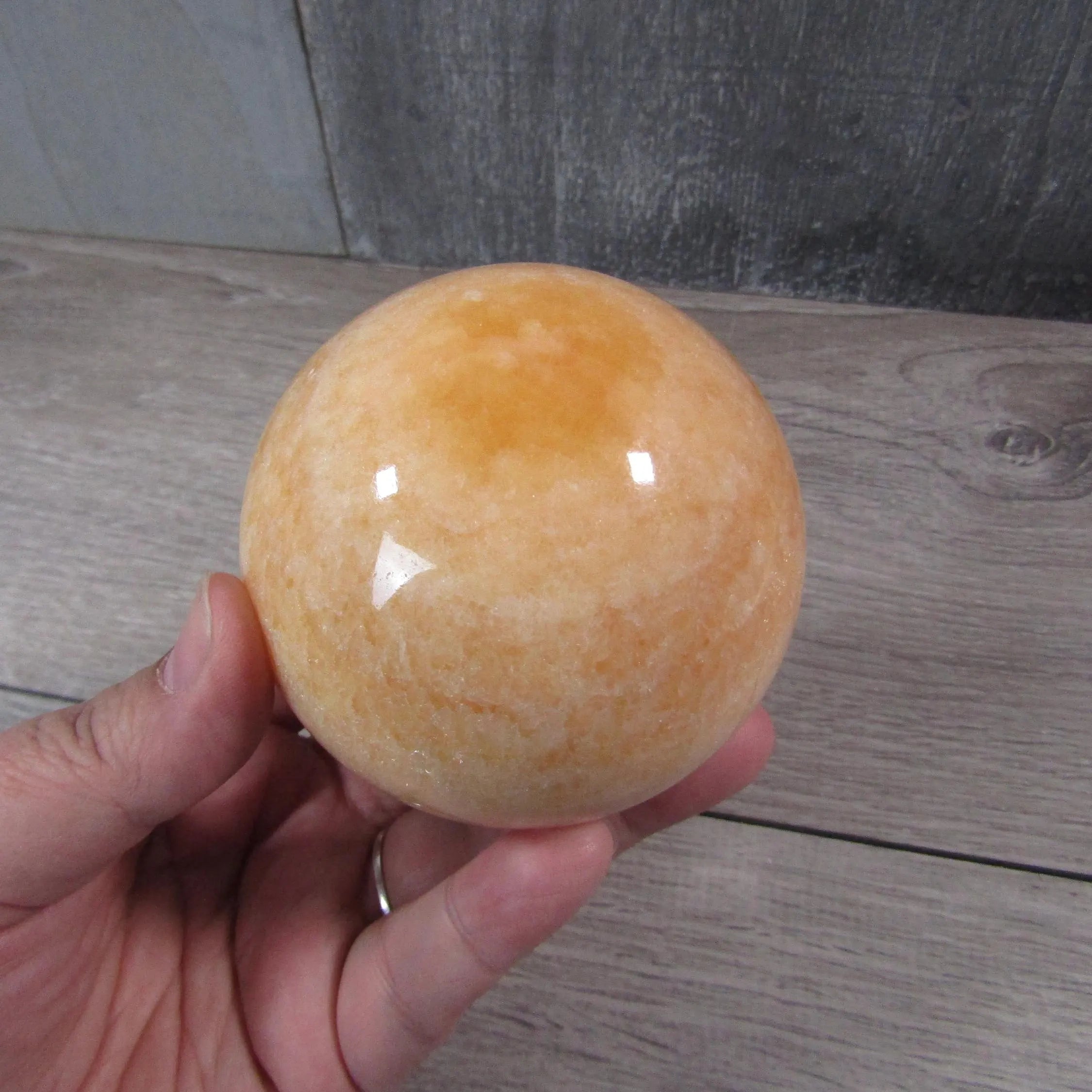 Orange calcite crystal sphere for retailers