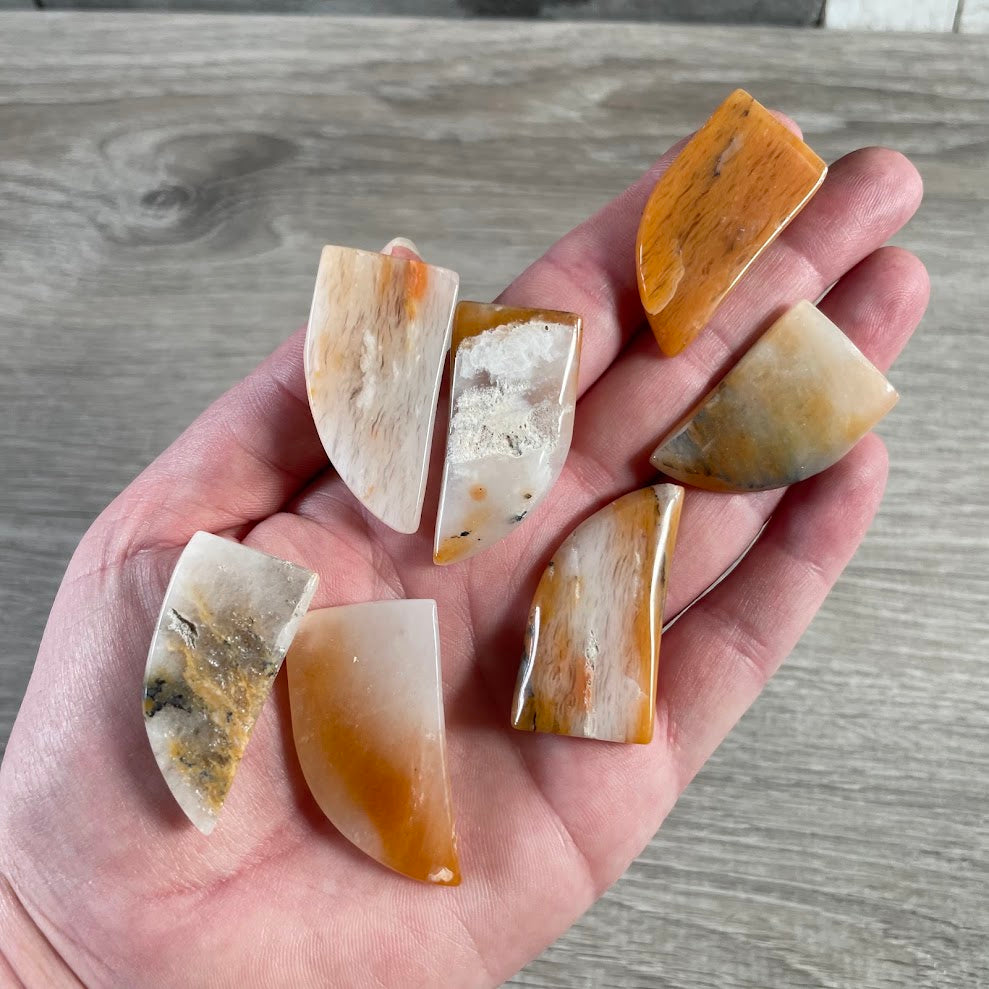 Included quartz polished gemstone claw-shaped crystal carving in natural stone