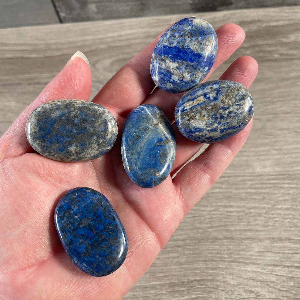 Lapis Lazuli polished gemstone palm stones from Afghanistan with natural colors and patterns