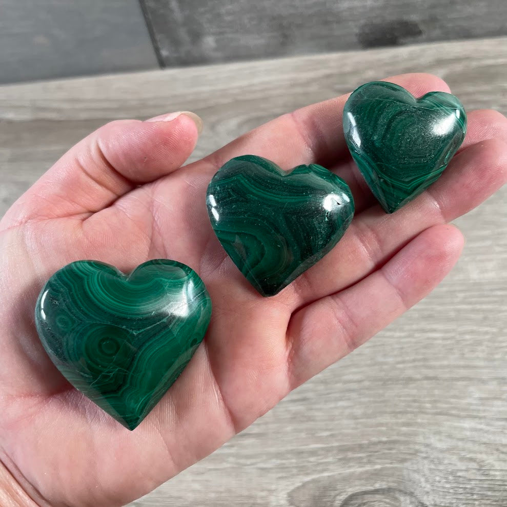 Polished malachite heart stone for crystal displays and boutique retail