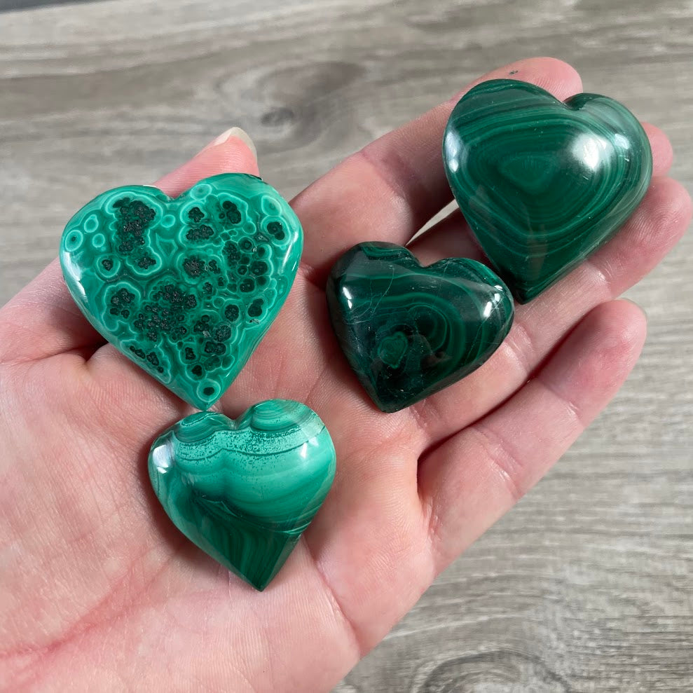 Polished malachite crystal heart for metaphysical shop inventory