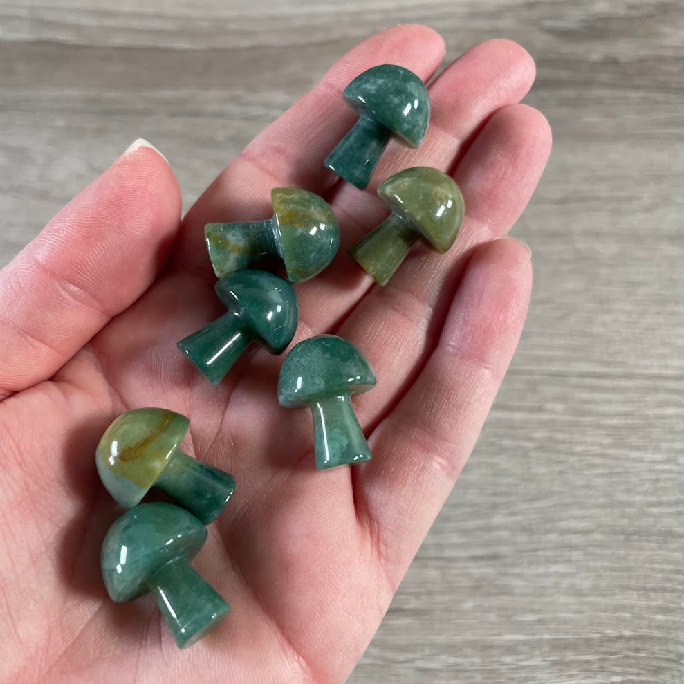 Small carved mushroom figurine made from moss agate natural gemstone