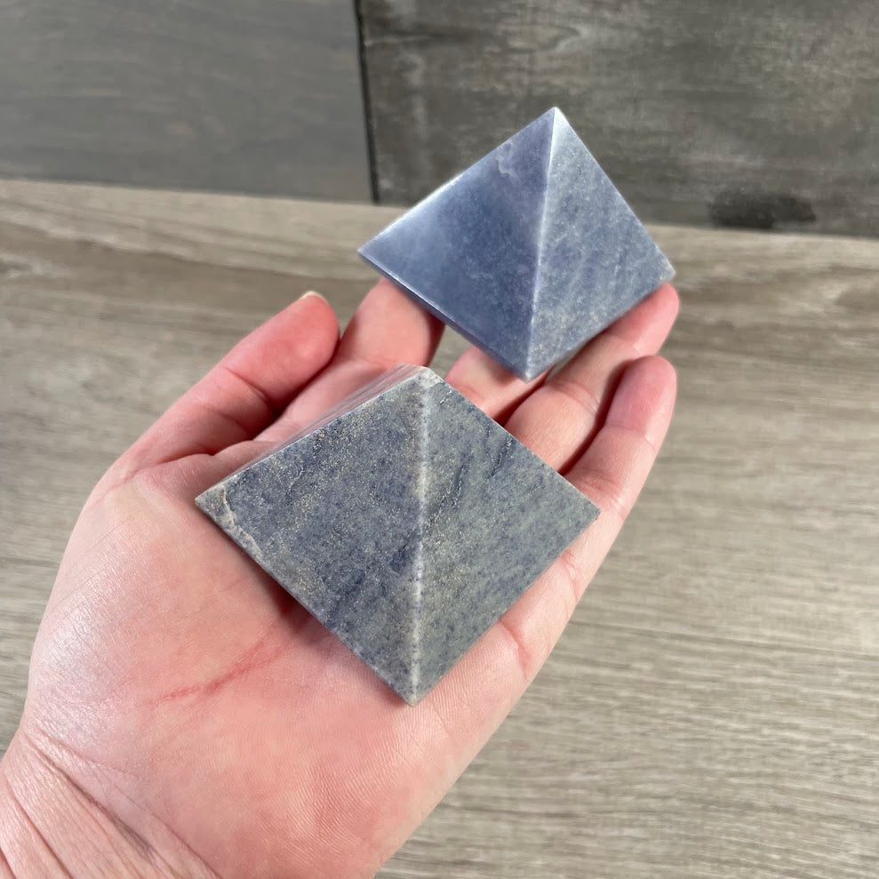 Polished natural gemstone pyramid carvings in assorted Brazilian stones