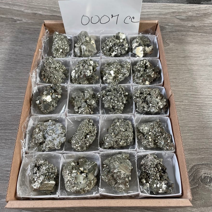 Raw pyrite crystal specimens sold by the half flat for resale