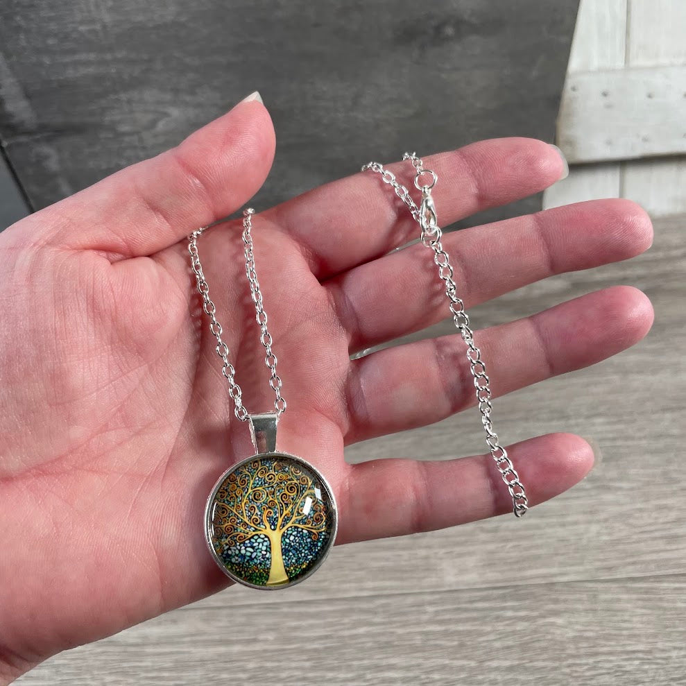 Silver tone metaphysical necklaces with assorted symbolic glass pendants