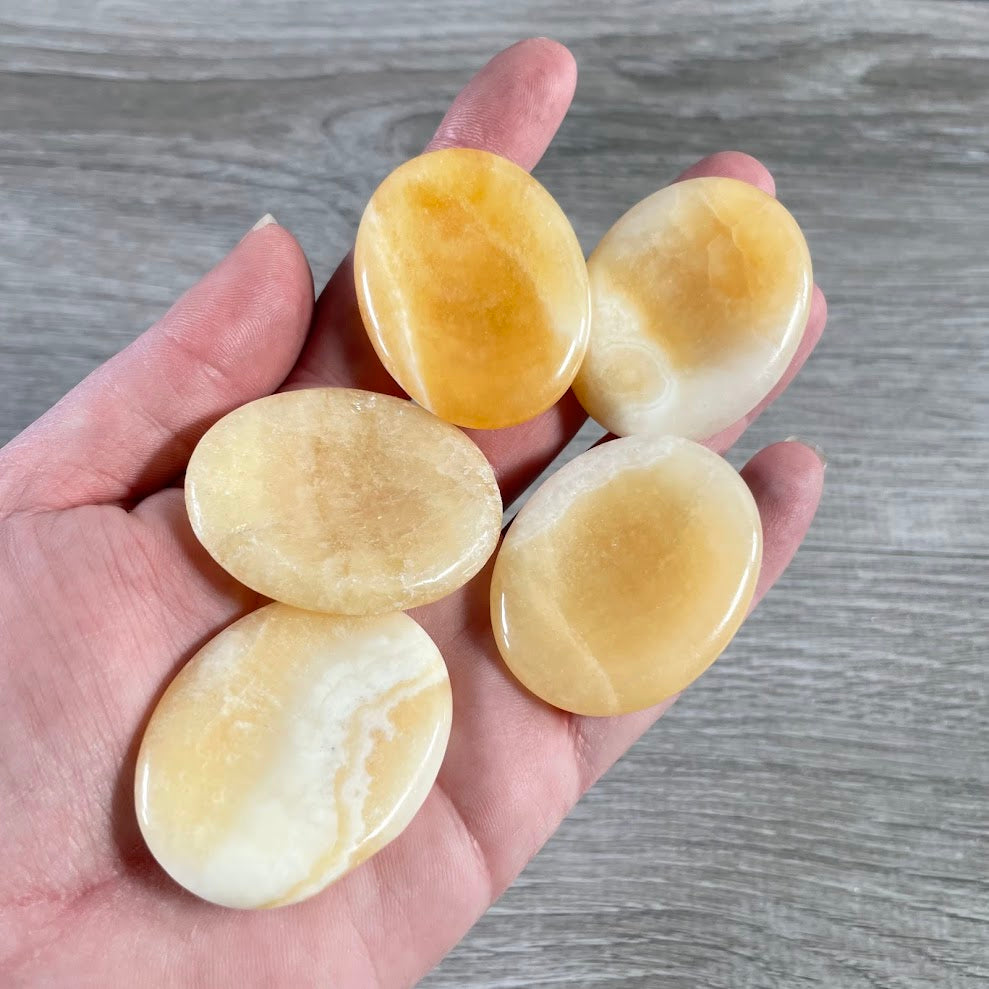 orange calcite wholesale oval pocket stones assorted natural gemstones for resale