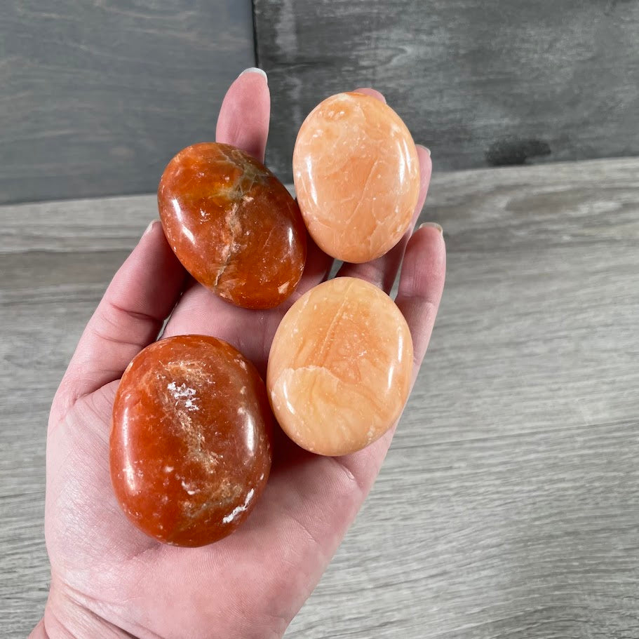 orange calcite gemstone palm stones sold by the ounce wholesale