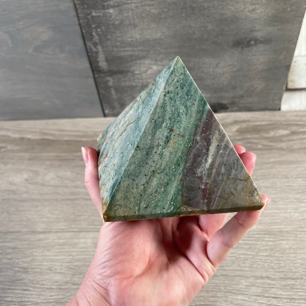 Polished crystal pyramid made from natural gemstone for crystal shop inventory
