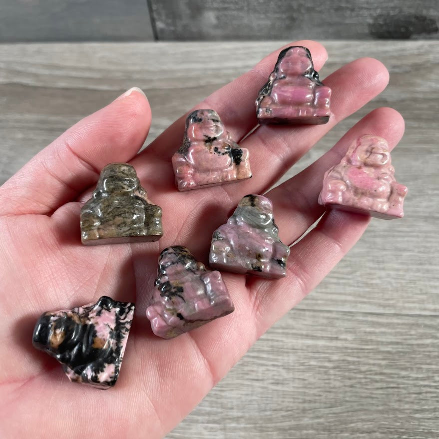 Rhodonite gemstone Buddha statue for metaphysical retail and altar arrangements